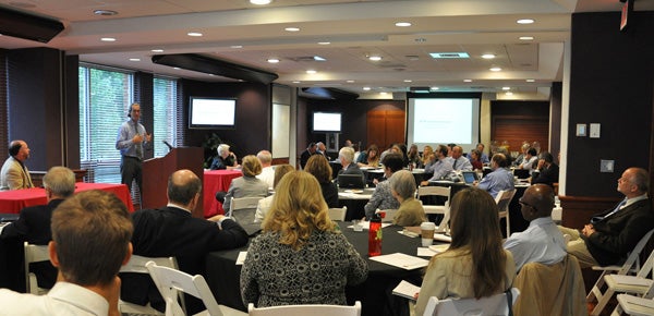 Associate Professor Nico Larco leads a panel discussion at the University of Maryland