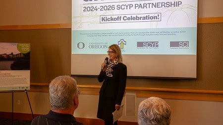 Dean Adrian Parr Zaretsky speaks to a diverse crowd at the Tualatin Public library. 
