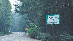 Photo of road in Oregon with welcome sign