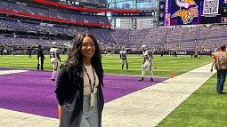 Naomi photograph on the Minnesota Vikings football team field. 