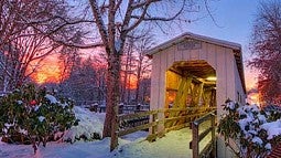 Photo of a Cottage Grove covered bridge in the snow