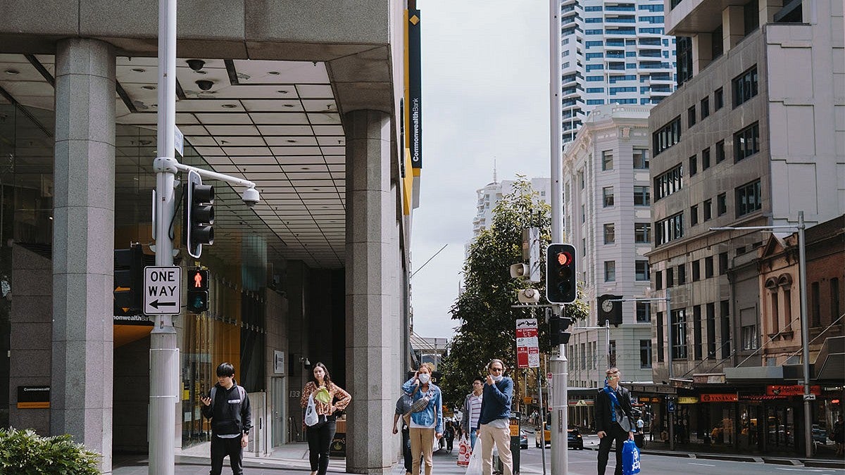 People standing on a city street corner