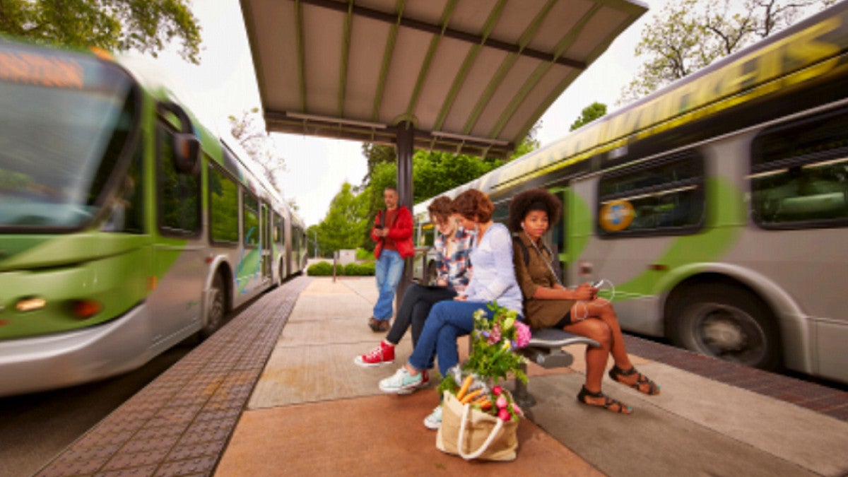 People waiting at bus stop